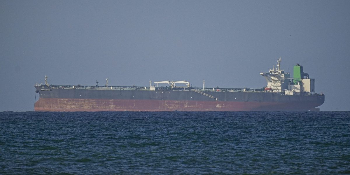 Three oil supertankers sail through the Strait of Hormuz